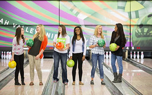 Students standing at bowling alley 